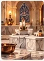 A marble hamam with two basins and warm light